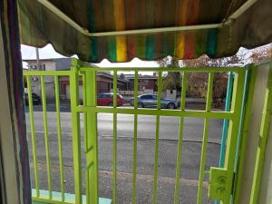 a window with a view of a street at Artsy fully equipped 2 bedrooms House all to yourself! in Bucharest