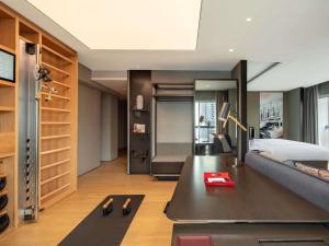 a living room with a couch and a table at Swissotel The Stamford Singapore in Singapore