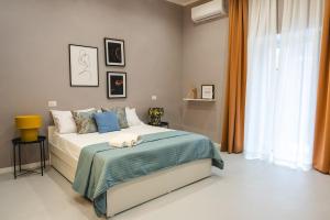 Voodi või voodid majutusasutuse a jump in Montesanto by Montesanto Luxury Domus toas