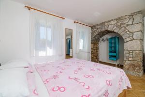 Giường trong phòng chung tại Apartments Insula Insule