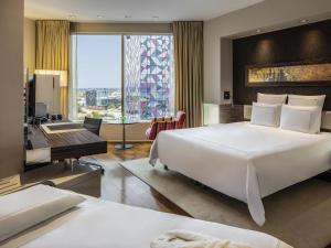 Ένα ή περισσότερα κρεβάτια σε δωμάτιο στο Swissotel Tallinn