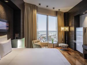 Ένα ή περισσότερα κρεβάτια σε δωμάτιο στο Swissotel Tallinn
