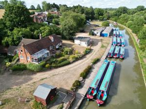 an aerial view of a river with boats parked at Waterside Cottage - Sleeps 11 on Grand Union Canal in Linslade