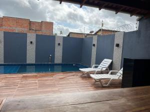 Swimmingpoolen hos eller tæt på Casa de Férias com Piscina + 1 billede