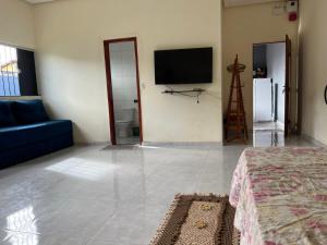 Et tv og/eller underholdning på Casa de Férias com Piscina