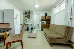 a living room with a couch and a table at Casa Aconchegante no Centro BC AV2393 in Balneário Camboriú