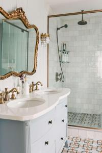 a white bathroom with a sink and a shower at Little Louis - A Princely Take on a County Getaway in Mountain View