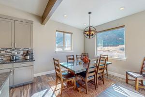 a kitchen and dining room with a table and chairs at Rim View 6 in Spanish Valley
