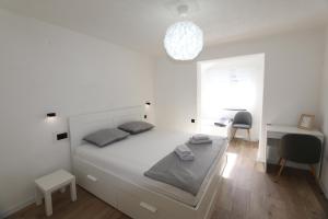Postel nebo postele na pokoji v ubytování Apartments Nadenic