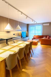 a large room with a long table and chairs at Apartmán MONTARA in Donovaly +13 photos