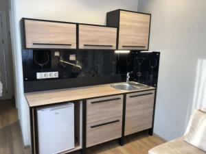 Kuchyň nebo kuchyňský kout v ubytování New Gudauri GoodHost Apartments + 99 fotografií