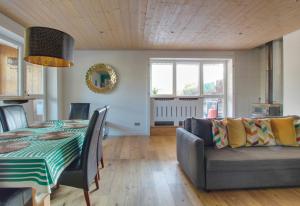a living room with a table and a couch at Gaillands North in Chamonix-Mont-Blanc