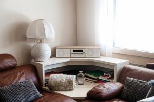 a living room with a couch and a table at Prada Laax by Quokka 360 - building with sauna in Laax
