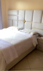 Postel nebo postele na pokoji v ubytování Sasha Residential