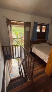 En eller flere senge i et værelse på Vila Sossego