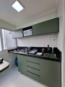 Kuchyň nebo kuchyňský kout v ubytování Studio central na cidade do Cristo
