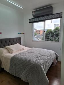 Postel nebo postele na pokoji v ubytování Studio central na cidade do Cristo