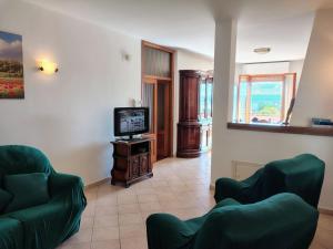 TV a/nebo společenská místnost v ubytování A Casa di Olga by Holiday World