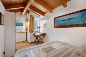 Ένα ή περισσότερα κρεβάτια σε δωμάτιο στο Appartamenti in Agriturismo