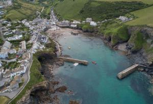 an aerial view of a town and a body of water at Miss Fishers in Port Isaac
