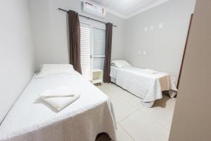 Ένα ή περισσότερα κρεβάτια σε δωμάτιο στο Pousada Flat Moreira Lima