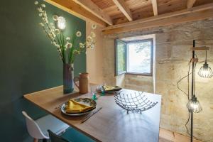 Posezení v ubytování Gite de la Ferme du Château 2 - Studio Climatisé + 5 fotografií