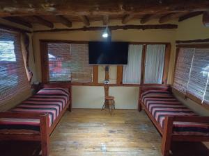 TV a/nebo společenská místnost v ubytování Rusticas