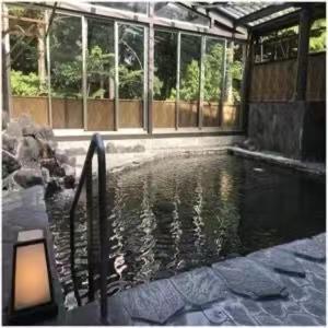 a pool of water in front of a building at Wyndham Garden Nagaizumi in Numazu