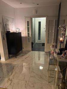 a living room with a dog sitting on a chair at Lapland Riverside Home in Rovaniemi