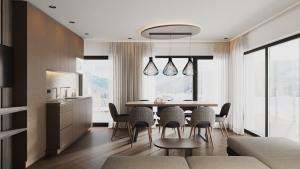 a kitchen and dining room with a table and chairs at Suitehouse, Premium Apartments, Pools & Spa in Dolomites - by Familiaris in Valdaora