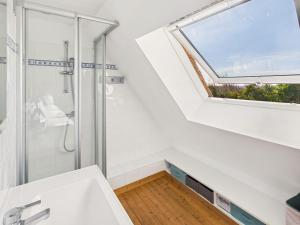 a bathroom with a shower and a window at Longère - 10 personnes - Vue mer in Tréguennec +22 photos