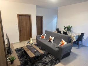 a living room with a couch and a table at Room cozy in San Julian 4 in St Julian's