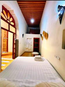 a bedroom with a bed in a room at Riad Ayoub Fes in Fès