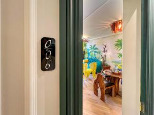 a room with a door with a dining room at Maya Suites - Premium Luxury Stay in Casablanca
