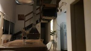 a dining room with a table and a television in a room at El tobogan in General Madariaga