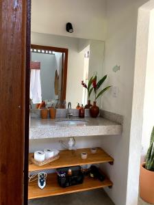 a bathroom with a sink and a mirror at Divina Casa in Itacaré +36 photos