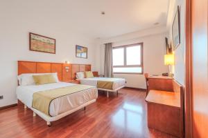 Postel nebo postele na pokoji v ubytování Hotel ITC Ciudad de Haro