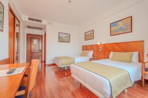 Ένα ή περισσότερα κρεβάτια σε δωμάτιο στο Hotel ITC Ciudad de Haro