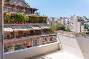 a view from the balcony of a building with plants at Athenian Manor by Staycom in Athens
