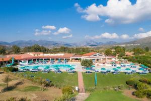 an aerial view of a resort with a pool at Cala Fiorita in Agrustos