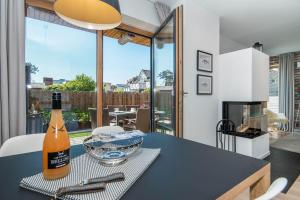 a bottle of wine sitting on a table in a kitchen at Sylt Lofts in Westerland
