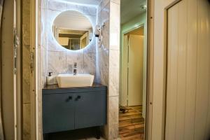 a bathroom with a sink and a mirror at MARİA House in Antalya +73 photos