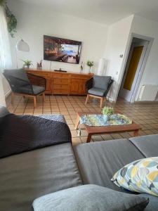 a living room with a couch and a table at The Hollidays Apartment in Calella