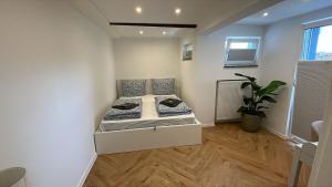 a bedroom with a bed in a room at Comfort in Hürth with pool and fireplace in Hürth