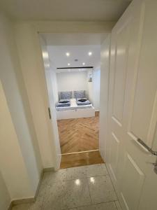 a hallway with two beds in a room at Comfort in Hürth with pool and fireplace in Hürth