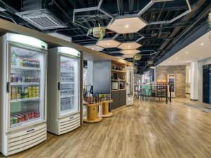 a store with two refrigerators in a room at ibis budget BH Savassi in Belo Horizonte