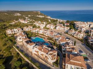 an aerial view of a resort with the ocean at NAU Salema Beach Village in Salema