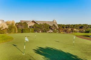 a golf course with three putts on a green at Ocean Breeze in Westport