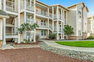 a large apartment building with a walkway at Ocean Breeze in Westport