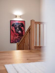 a picture of a sheep with glasses on the wall at Chalet Pirchhof inklusive Sauna in Sautens +28 photos